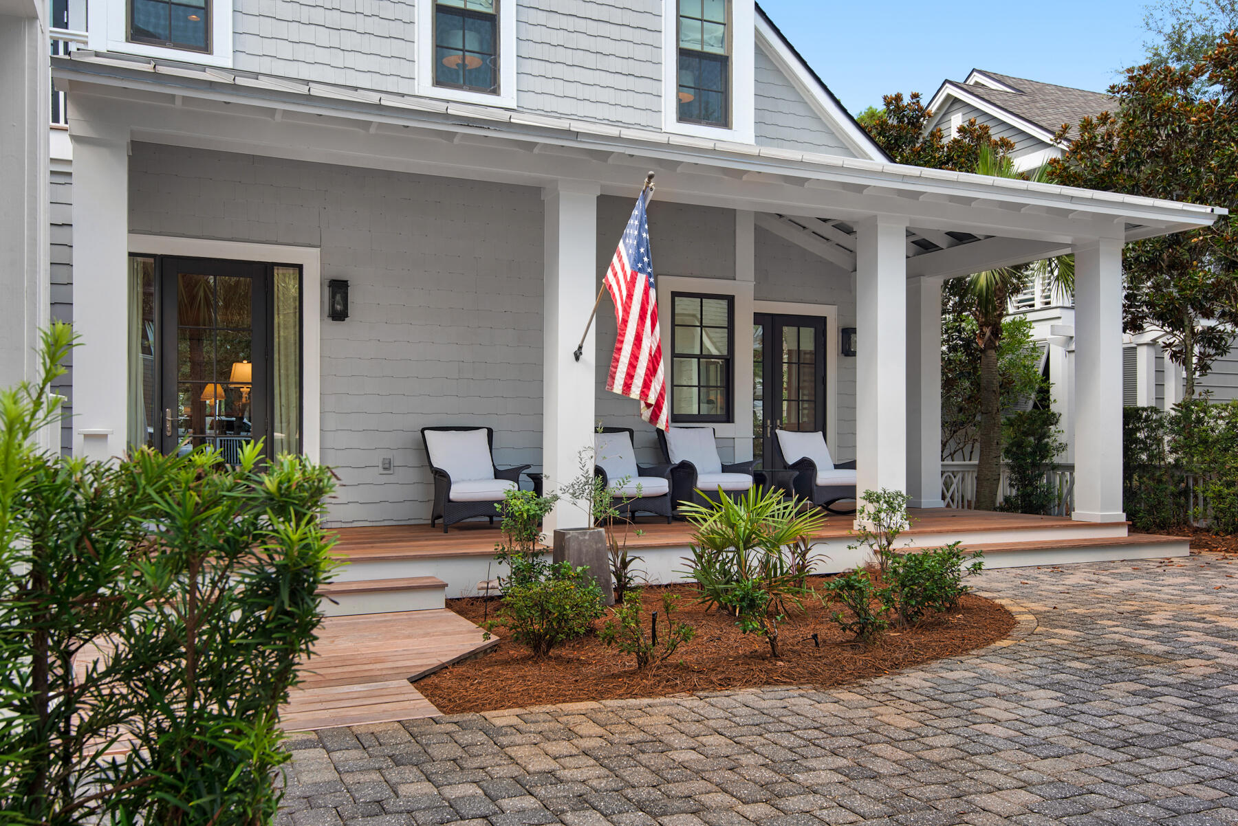 9 Tidepool Lane Inlet Beach, FL 32461 - Photo 5 of 86 a view of a house with potted plants and a bench in front of it