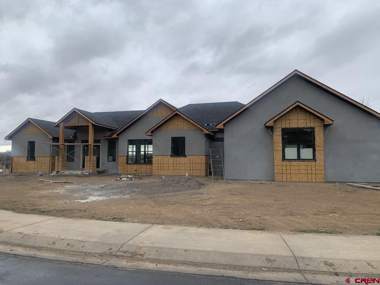 1778 Trapper Court Delta, CO 81416 - Photo 1 of 3 a front view of a house with a yard