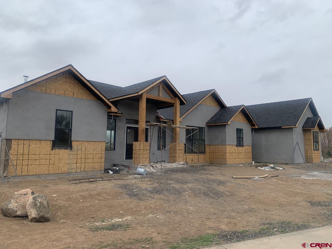 1778 Trapper Court Delta, CO 81416 - Photo 2 of 3 a front view of a house with a garage