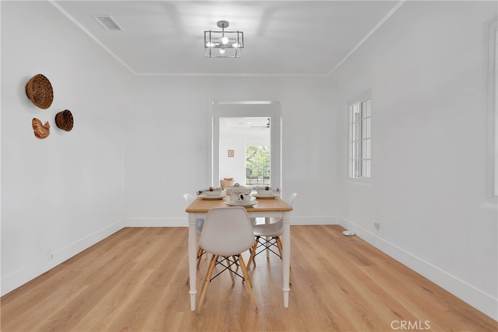 3489 Circle Road San Bernardino, CA 92405 - Photo 14 of 51 a view of a dining room with furniture and wooden floor