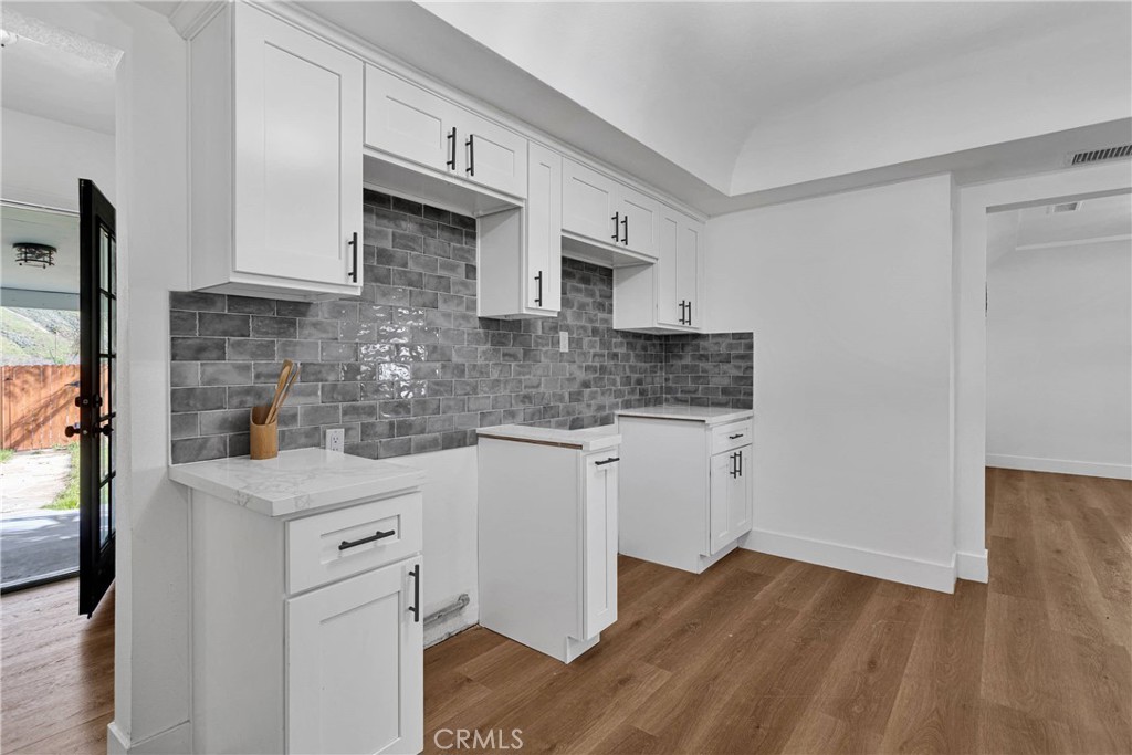 3489 Circle Road San Bernardino, CA 92405 - Photo 17 of 51 a kitchen with stainless steel appliances granite countertop a sink stove and cabinets