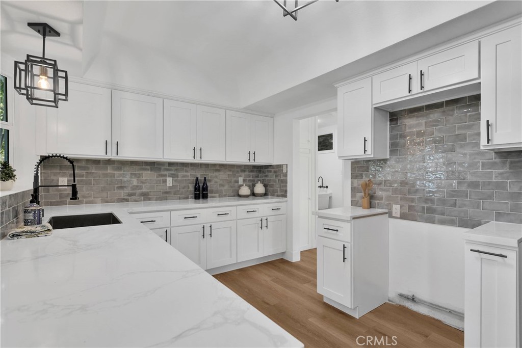 3489 Circle Road San Bernardino, CA 92405 - Photo 19 of 51 a kitchen with white cabinets sink and white appliances