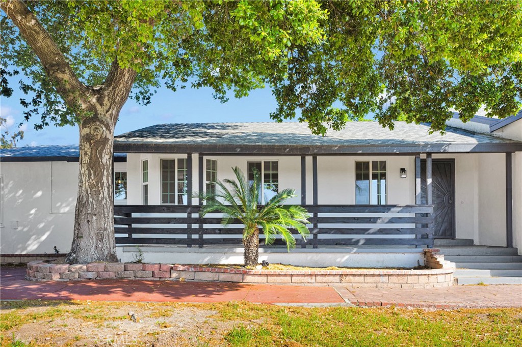 3489 Circle Road San Bernardino, CA 92405 - Photo 2 of 51 a front view of a house with garden