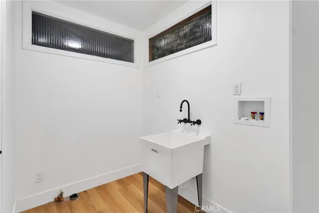 a bathroom with a sink and mirror