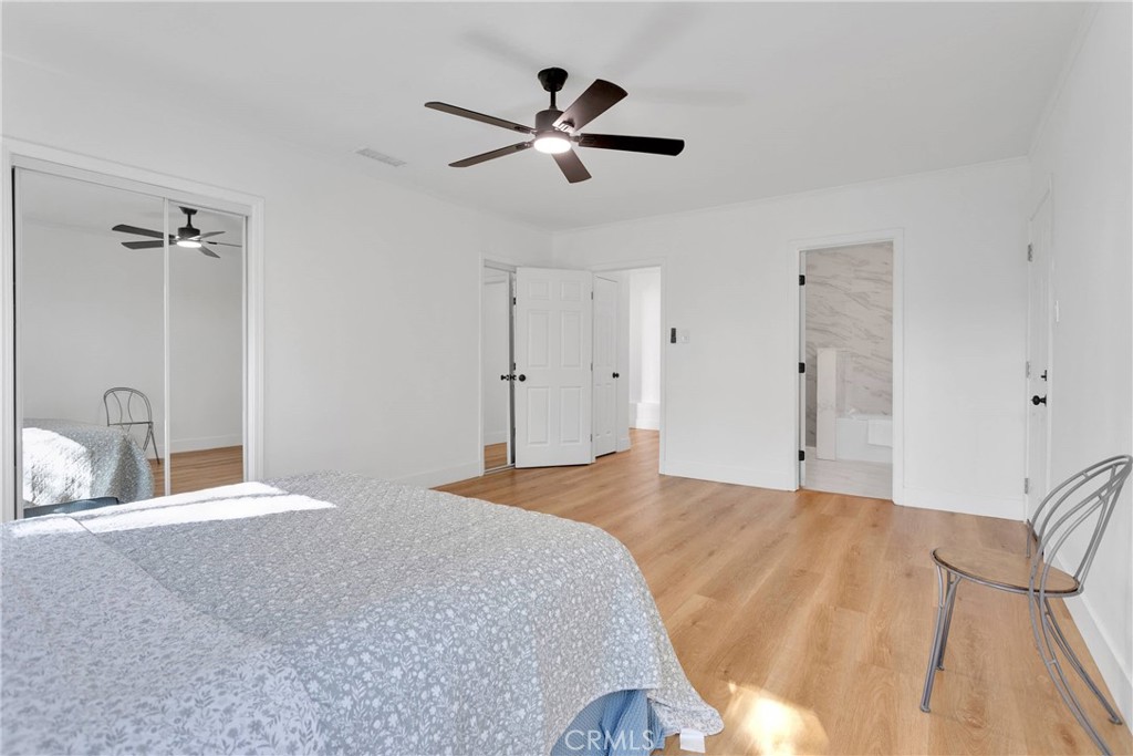 3489 Circle Road San Bernardino, CA 92405 - Photo 26 of 51 a bedroom with a bed and ceiling fan