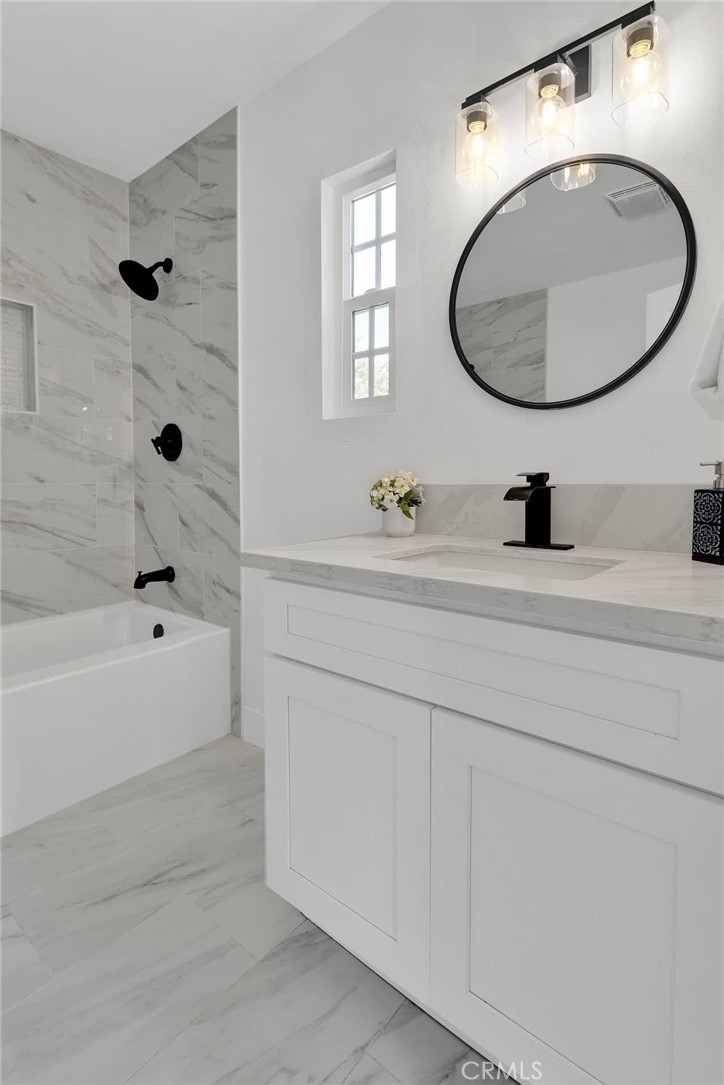 3489 Circle Road San Bernardino, CA 92405 - Photo 29 of 51 a bathroom with a sink and a mirror