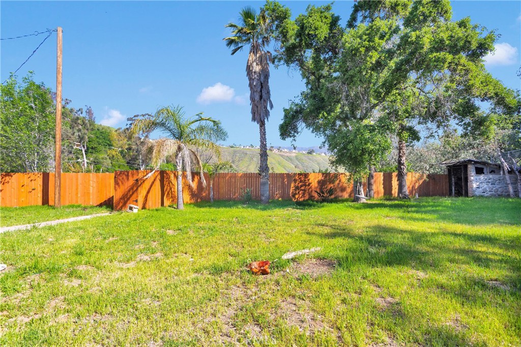 3489 Circle Road San Bernardino, CA 92405 - Photo 34 of 51 a backyard of a house with lots of green space