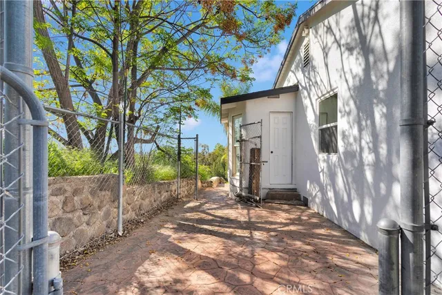 a view of a house with a tree in front