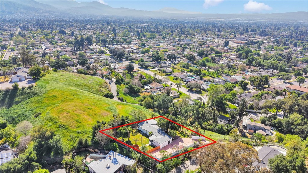 3489 Circle Road San Bernardino, CA 92405 - Photo 42 of 51 an aerial view of residential houses with outdoor space and trees