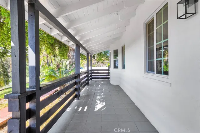 a view of a porch and garden