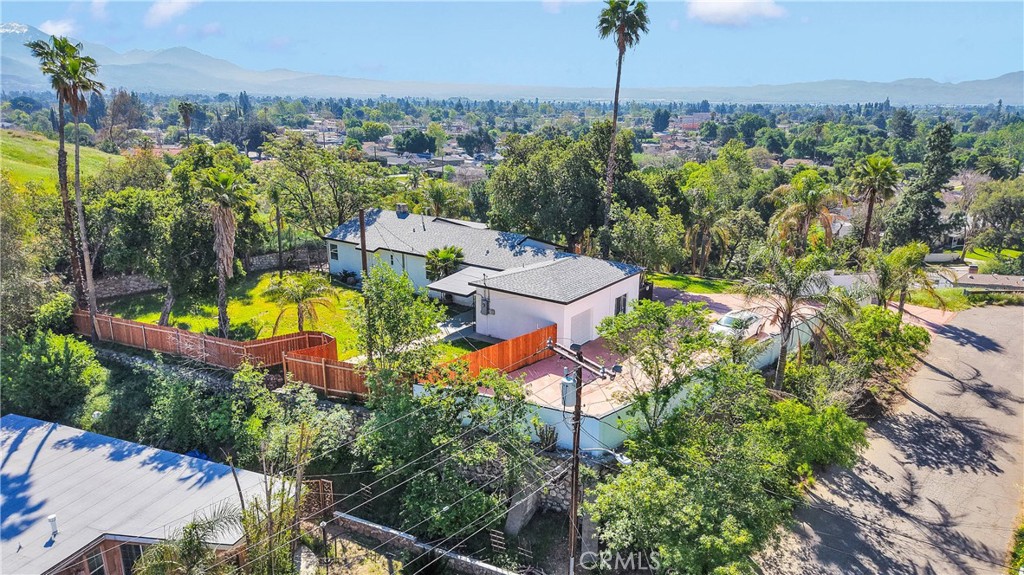 3489 Circle Road San Bernardino, CA 92405 - Photo 51 of 51 an aerial view of a house with a garden and lake view