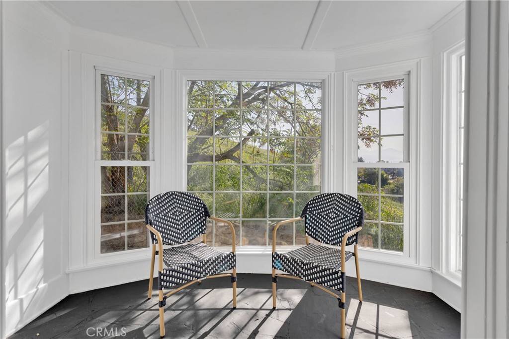 3489 Circle Road San Bernardino, CA 92405 - Photo 9 of 51 a chair sitting in a room next to a window