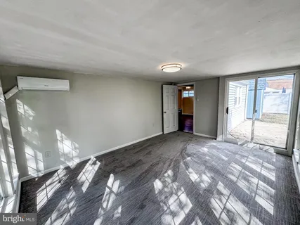 a view of an empty room and window