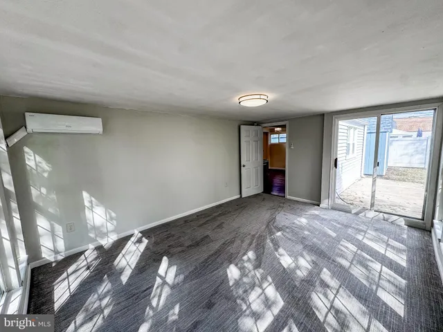 a view of an empty room and window