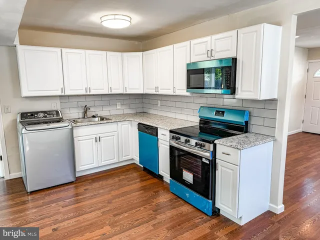 a kitchen with a stove and a microwave