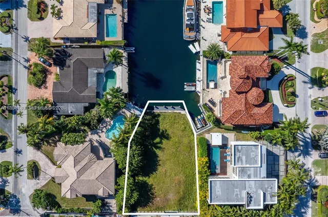 an aerial view of houses with outdoor space