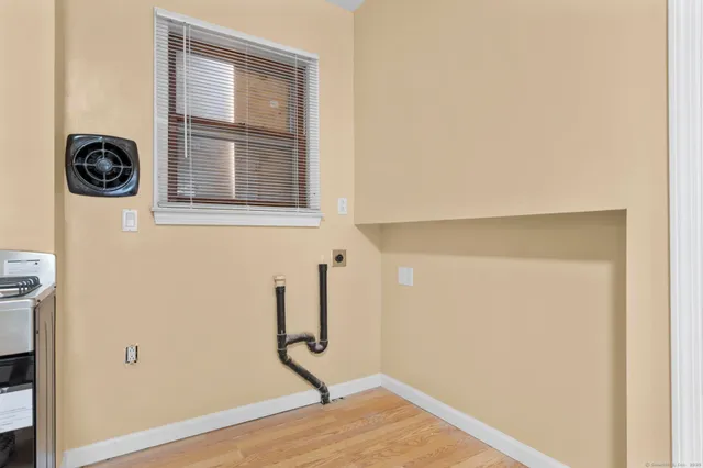 a view of an empty room with a window