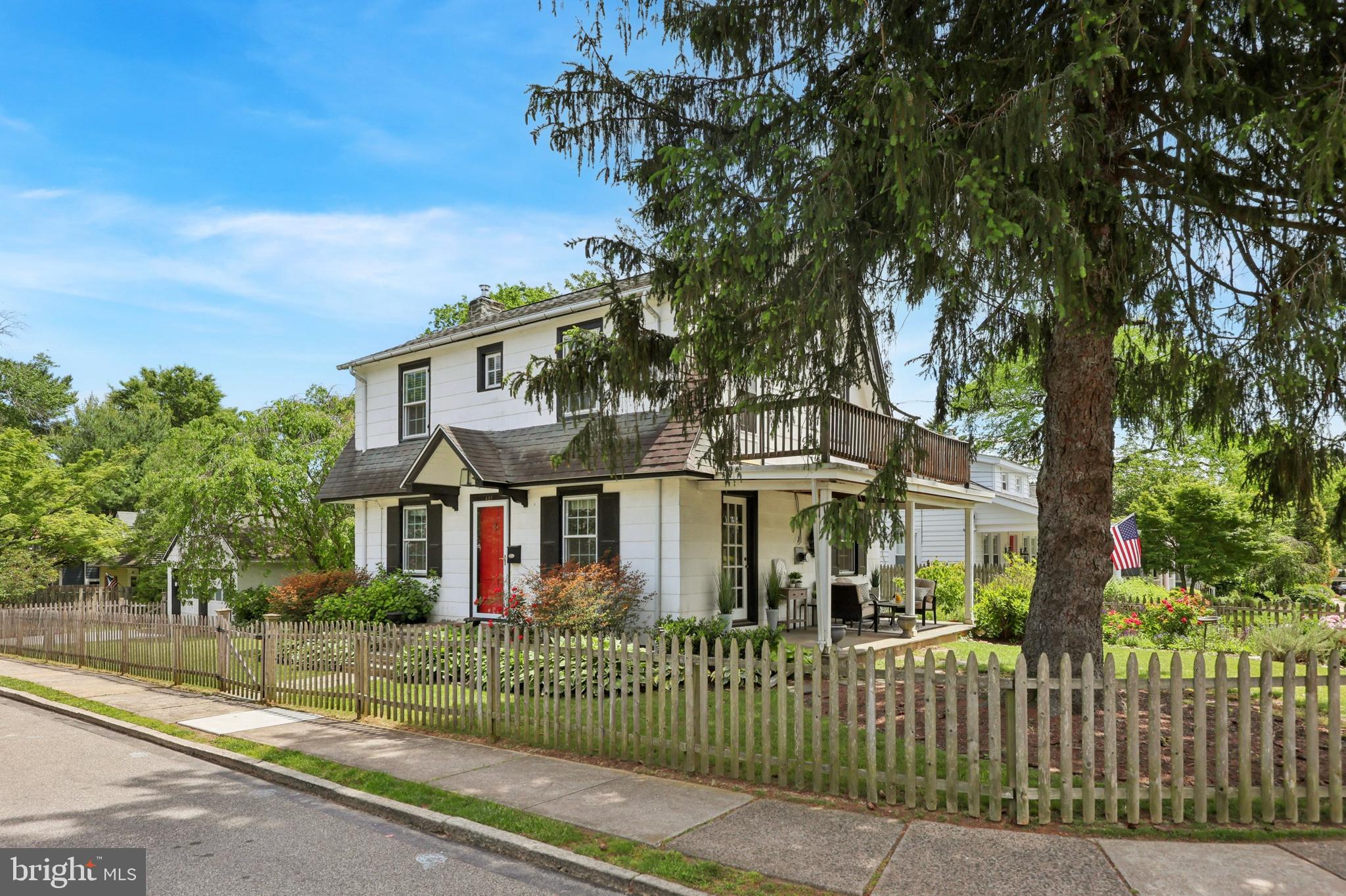 427 Righters Mill Road Gladwyne, PA 19035 - Photo 14 of 16 front view of a house with a garden