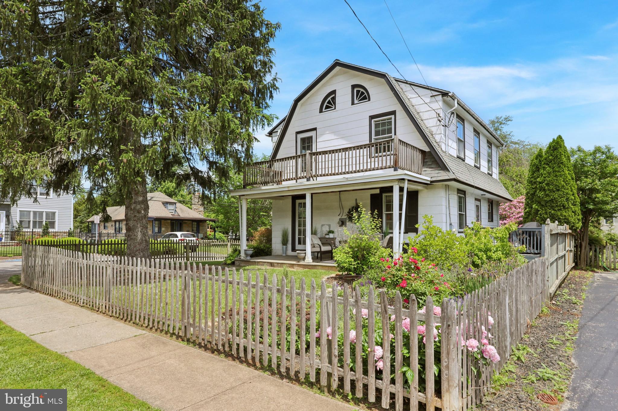 427 Righters Mill Road Gladwyne, PA 19035 - Photo 2 of 16 a view of a house with a small yard and plants