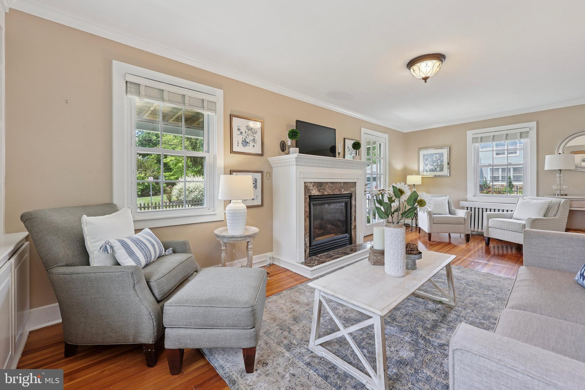 427 Righters Mill Road Gladwyne, PA 19035 - Photo 4 of 16 a living room with furniture large window and a fireplace