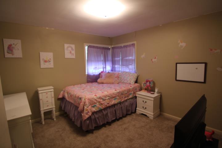 4177 Spirea Drive Columbus, GA 31907 - Photo 13 of 21 a bed room with a bed and a chair