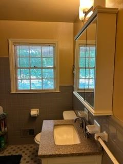 4177 Spirea Drive Columbus, GA 31907 - Photo 15 of 21 a bathroom with a sink mirror vanity and toilet