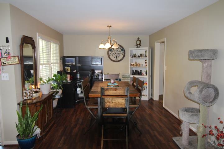 4177 Spirea Drive Columbus, GA 31907 - Photo 2 of 21 a very nice looking dining room with wooden floor and a clock