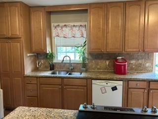 4177 Spirea Drive Columbus, GA 31907 - Photo 3 of 21 a kitchen with stainless steel appliances granite countertop wooden cabinets a sink and dishwasher