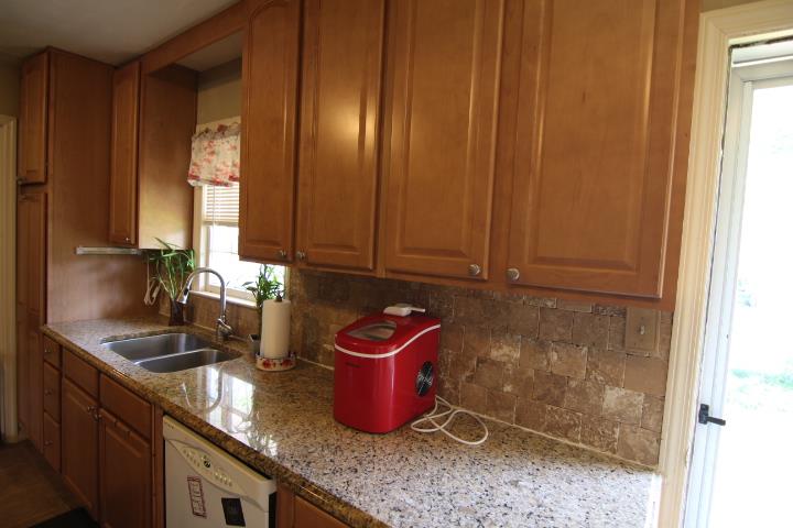 4177 Spirea Drive Columbus, GA 31907 - Photo 7 of 21 a kitchen with granite countertop cabinets and sink