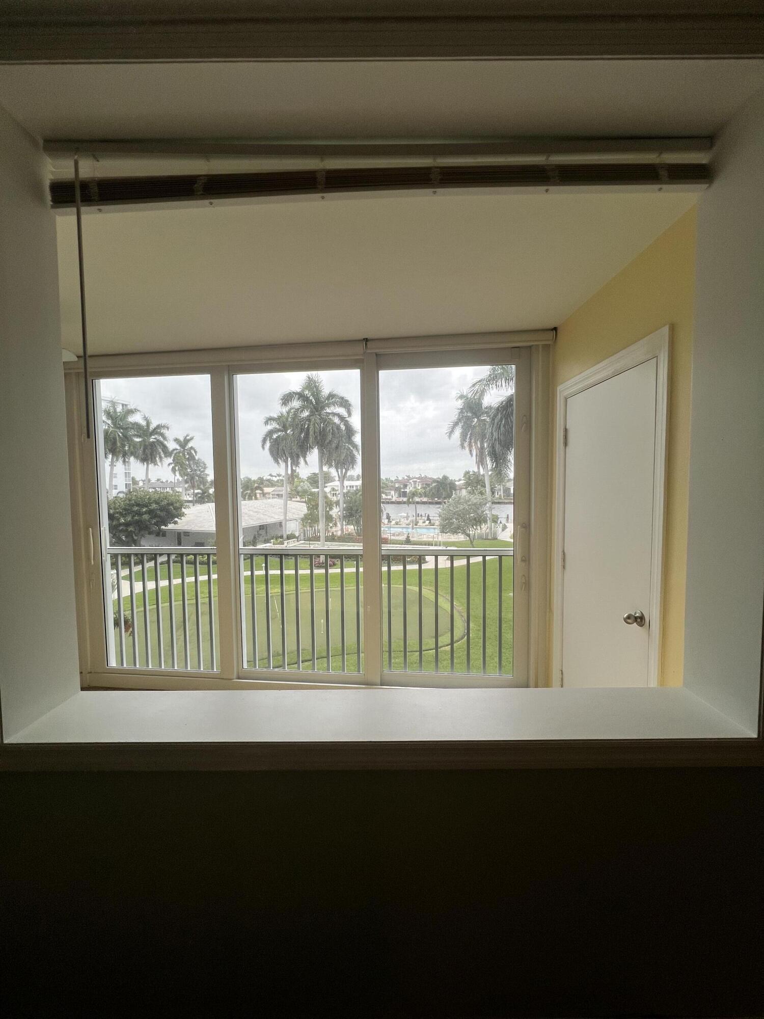 3224 South Ocean Boulevard, Unit 310B Highland Beach, FL 33487 - Photo 11 of 26 a view of an empty room with a window