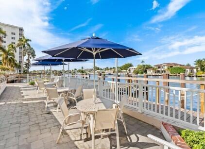 3224 South Ocean Boulevard, Unit 310B Highland Beach, FL 33487 - Photo 21 of 26 a view of a chairs and table in the balcony