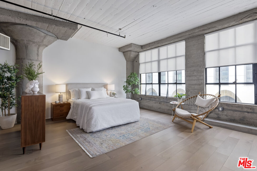 200 North San Fernando Road, Unit 208 Los Angeles, CA 90031 - Photo 13 of 37 a spacious bedroom with a bed and glass window