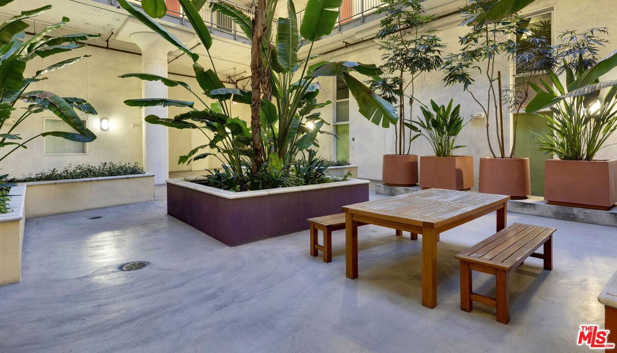 200 North San Fernando Road, Unit 208 Los Angeles, CA 90031 - Photo 31 of 37 a swimming pool with outdoor seating and wooden floor