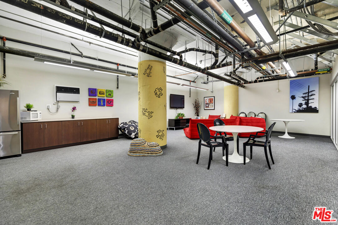 200 North San Fernando Road, Unit 208 Los Angeles, CA 90031 - Photo 35 of 37 a view of a dining room with furniture and a chandelier