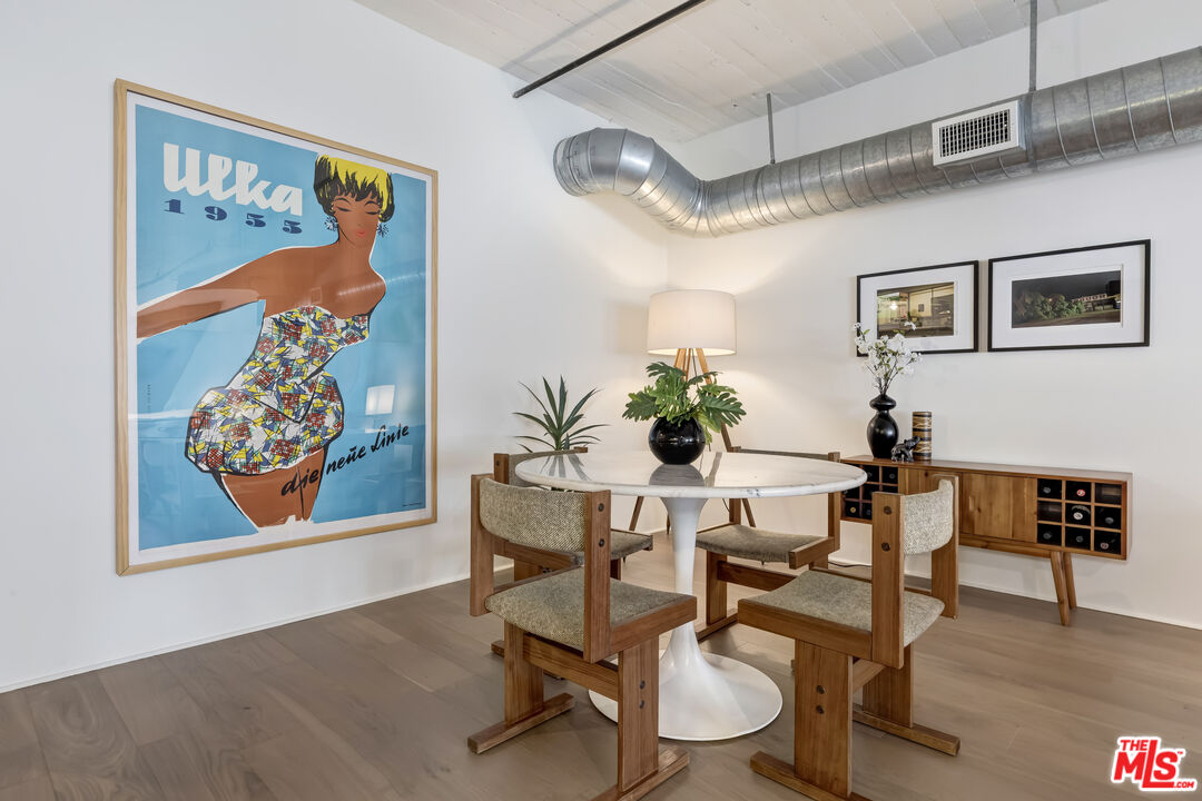200 North San Fernando Road, Unit 208 Los Angeles, CA 90031 - Photo 8 of 37 a dining room with furniture and wooden floor
