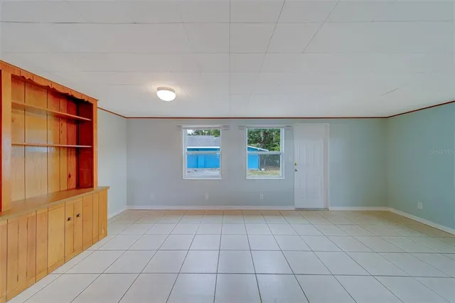 a view of an empty room with a window