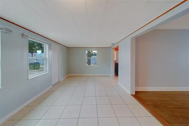 a view of a livingroom with a ceiling fan and a window