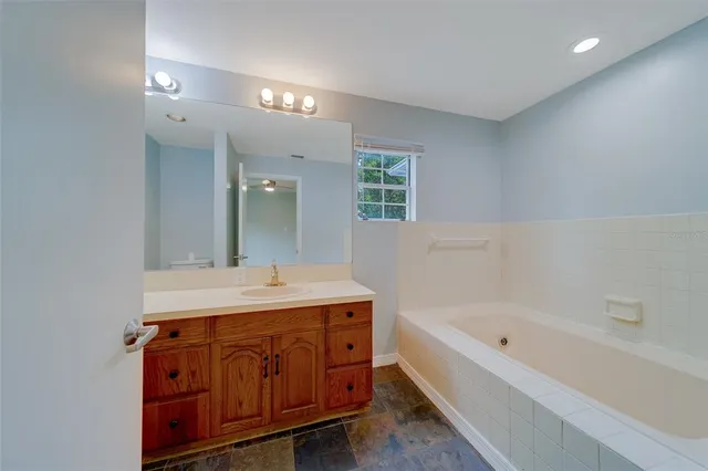 an aerial view of a houses with a yard