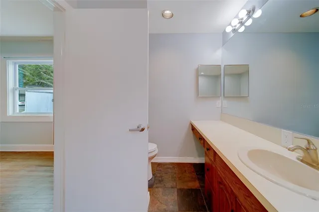 an aerial view of a houses with a swimming pool