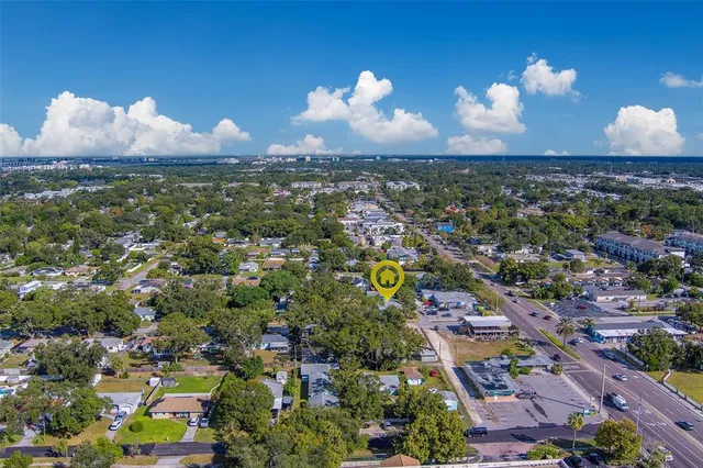 an aerial view of residential houses with outdoor space