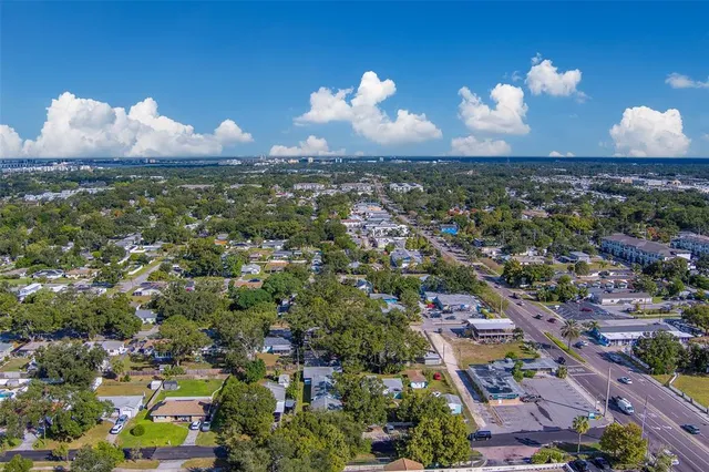 an aerial view of a house with a swimming pool