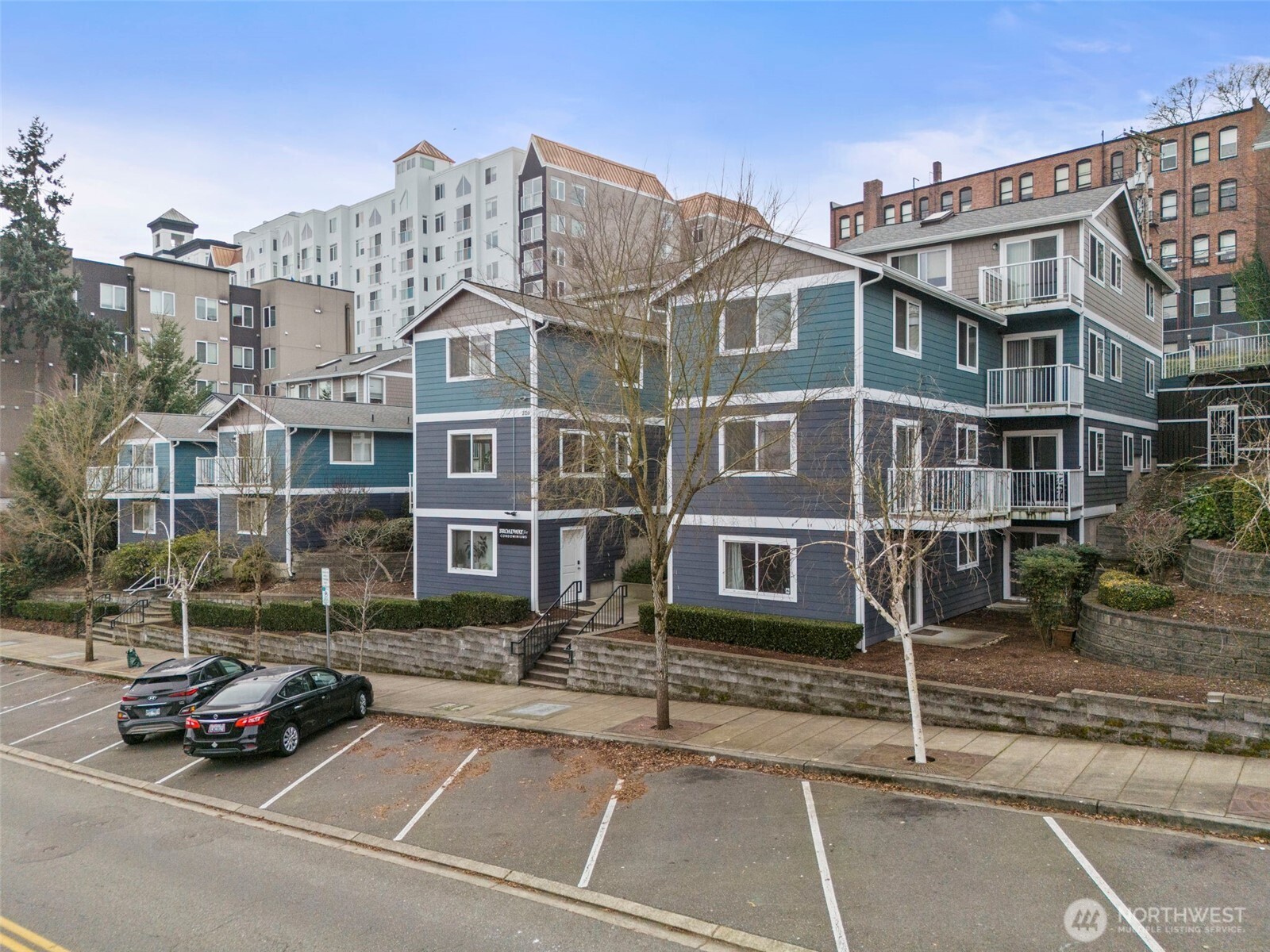 218 Broadway, Unit 5 Tacoma, WA 98402 - Photo 1 of 32 a view of a street that has a car parked on the road