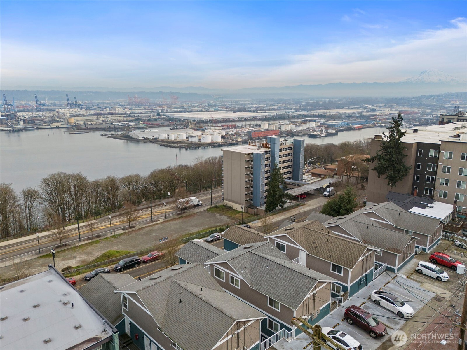 218 Broadway, Unit 5 Tacoma, WA 98402 - Photo 2 of 32 an aerial view of a house with a lake view