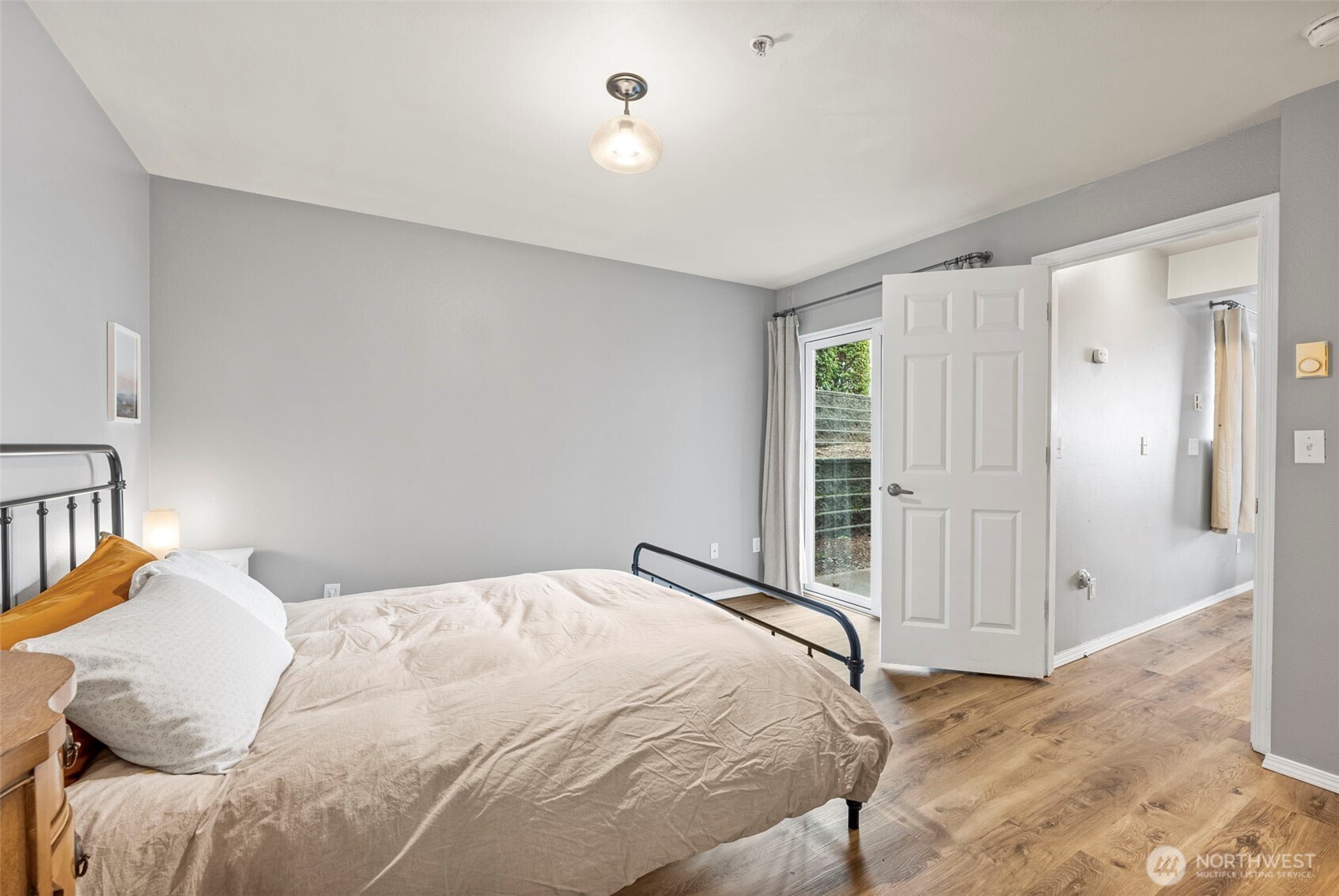 218 Broadway, Unit 5 Tacoma, WA 98402 - Photo 21 of 32 a bedroom with a bed and a window