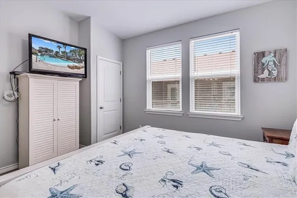 a large white bed in a white room