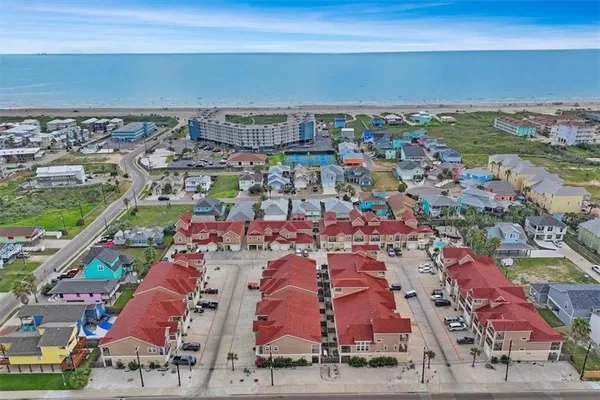 an aerial view of residential houses with outdoor space