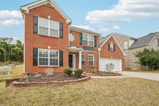 front view of a house with a yard