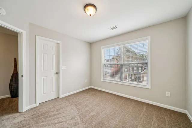 an empty room with a empty space and a window