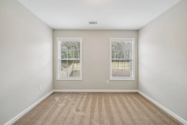 a bedroom with a bed and a flat screen television