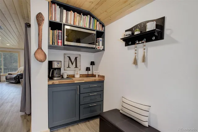 a kitchen with a sink and a stove top oven